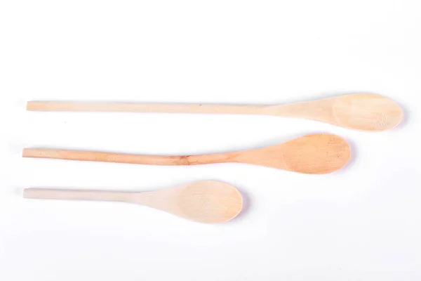 Set of wooden spoons, white background. — Stock Photo, Image