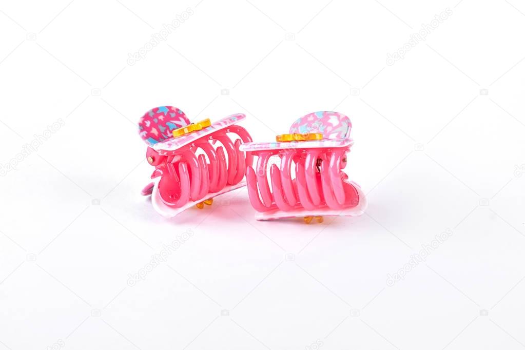 Colorful hair clips on white background.