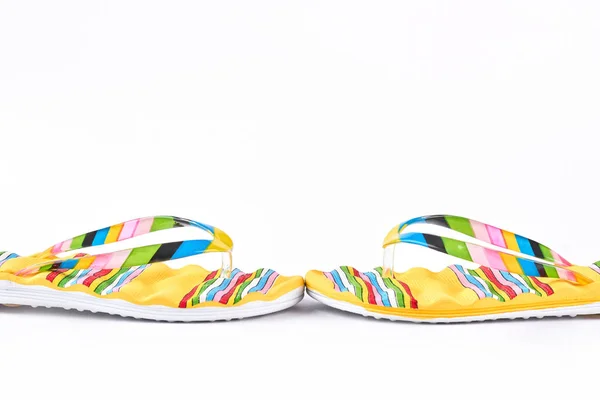 Novos chinelos coloridos no fundo branco . — Fotografia de Stock