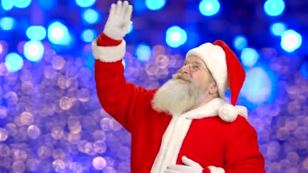 Weihnachtsmann winkt mit der Hand. — Stockvideo