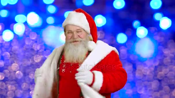 Santa dancing on lights background. — Stock Video