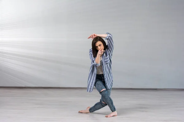 Young female dancer on studio background. — Stock Photo, Image