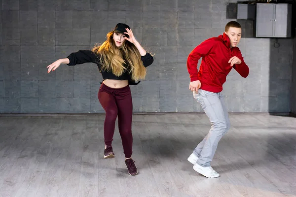 Hip-hop dancers in movement.