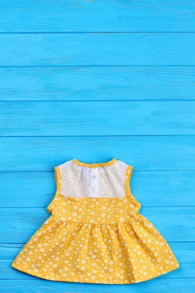 Yellow summer dress for infant girls.