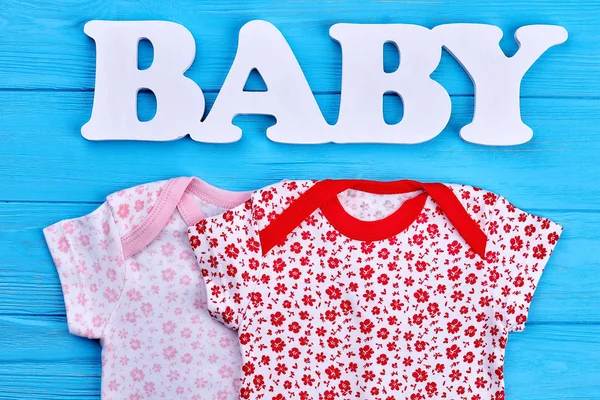 Set of patterned baby-girl clothing. — Stock Photo, Image