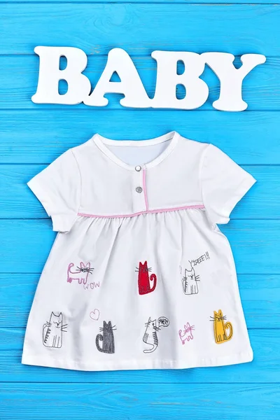 Baby-girl summer clothing background. — Stock Photo, Image