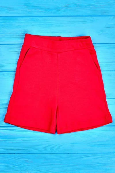 Red pocket cotton shorts for kids. — Stock Photo, Image