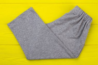 Gray melange pants on yellow clipart