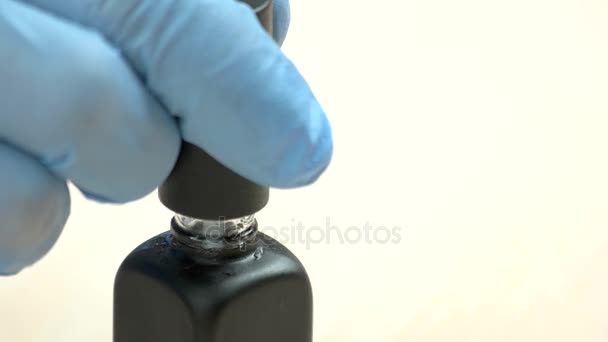 Manicurist hand holding nail polish brush. — Stock Video