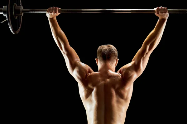 Persistent man lifting a barbell — Stock Photo, Image