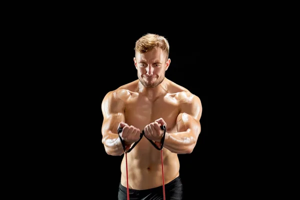 Athlete stretching a resistance band — Stock Photo, Image