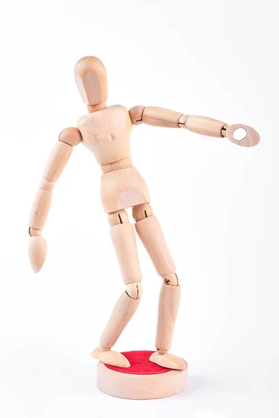 Action of wooden human dummy.
