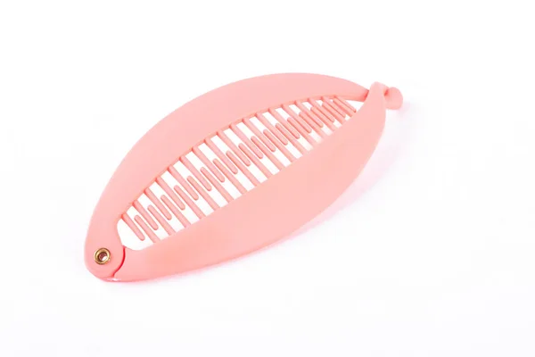 Plastic pink banana hair clip.