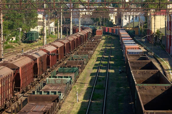 Freight trains empty containers.