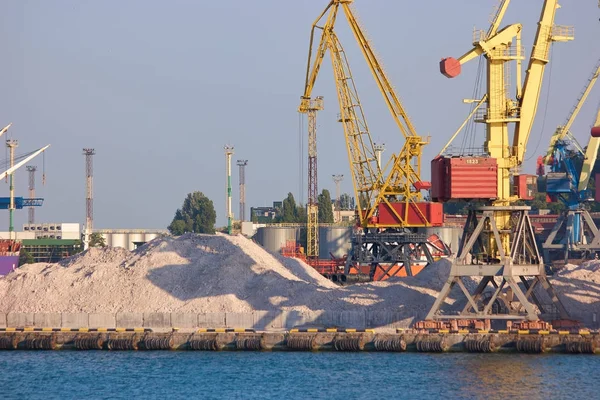 Pile of sand on a sea port.