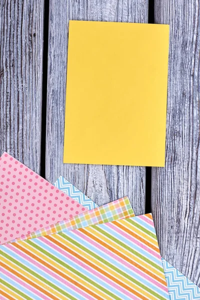 Blank card and patterned paper sheets.