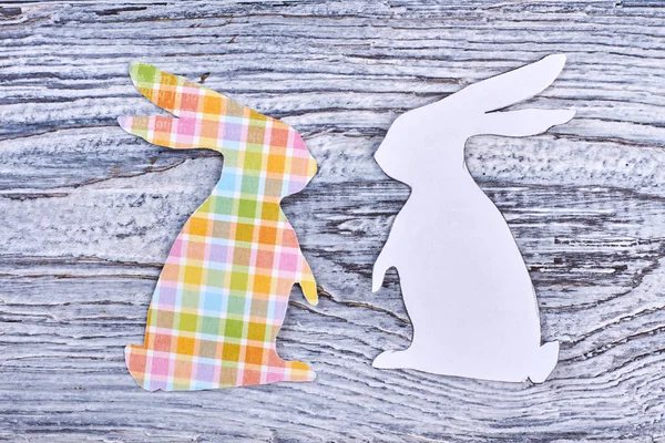 Paper rabbit cutouts, top view. — Stock Photo, Image