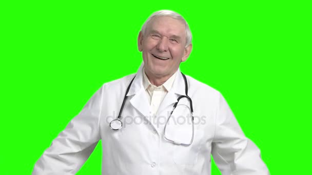 Senior doctor laughing at your joke, slow-motion. — Stock Video