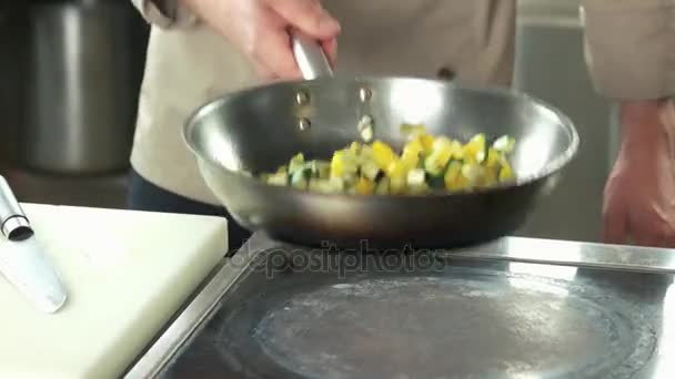 Hand of chef frying vegetables. — Stock Video