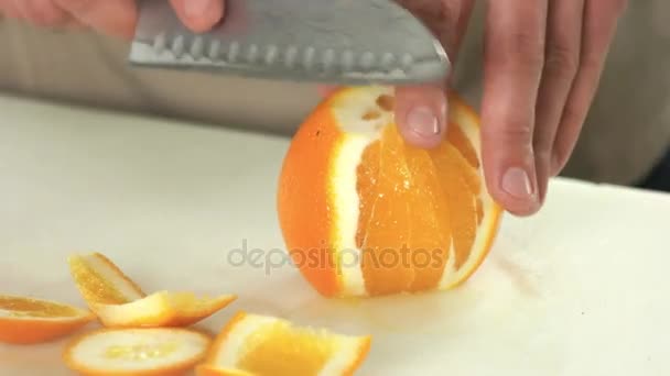 Hands peeling orange. — Stock Video