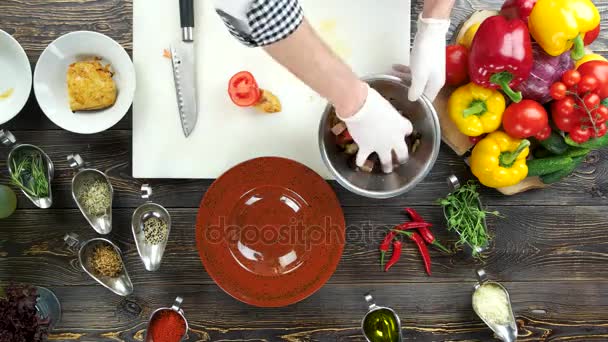 Hands making salad, wooden table. — Stock Video