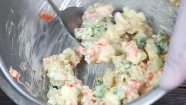Spoon mixing salad close up. — Stock Video