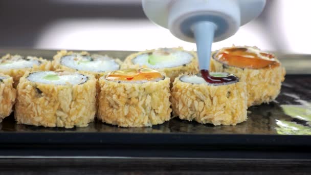 Unagi maki rolls with sauce. — Stock Video