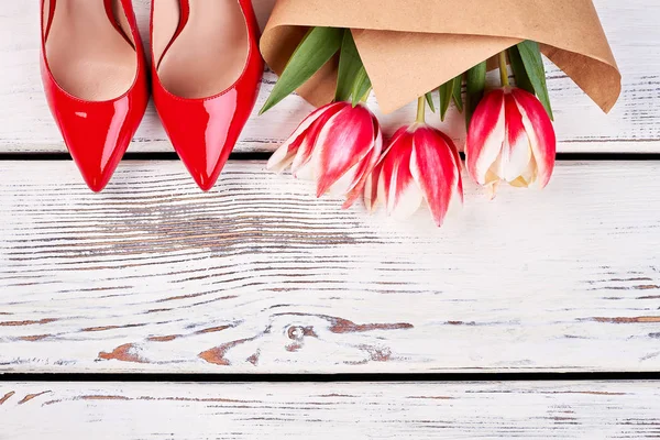 Red pump shoes and flowers