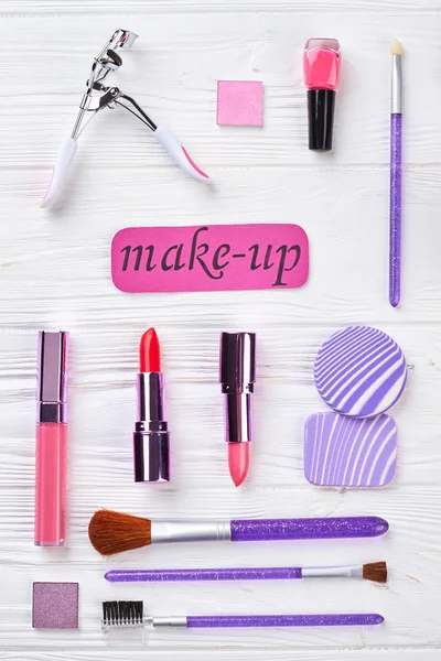 Collection of make up products, top view.