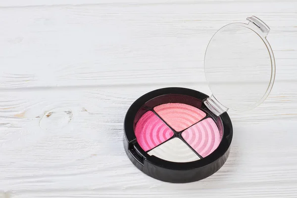 Palette of pink eyeshadows in plastic container. — Stock Photo, Image