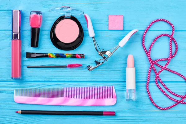 Set of pink cosmetics and accessories.