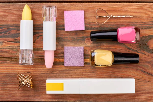 Flat lay cosmetics on brown wooden background. — Stock Image Flat lay cosmetics on brown wooden background. Royalty Free Stock Photos