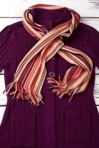 Women fashion cardigan and scarf.