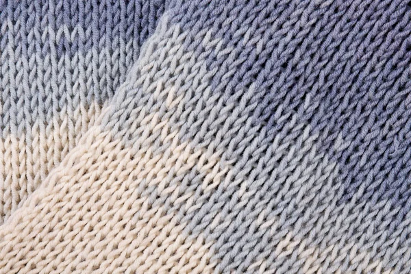 Blå stickning bakgrund av handgjorda ull mönster. — Stockfoto