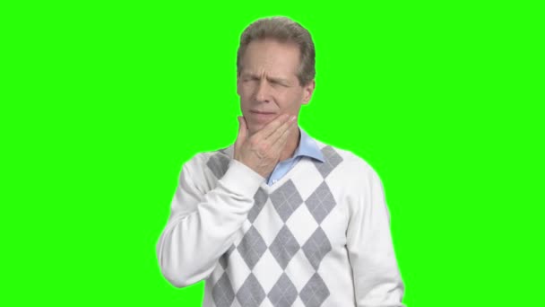 Mature man having toothache, green screen. — Stock Video