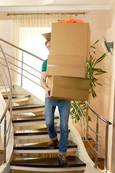 Guy carrying stack of boxes. — Stock Photo, Image