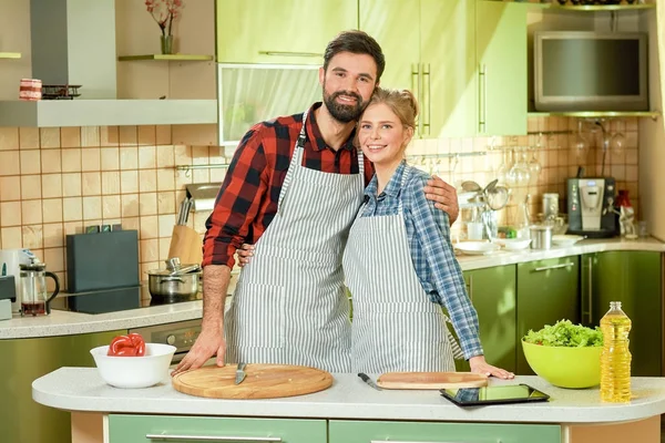 Happy couple at cooking table. — Stock Photo, Image