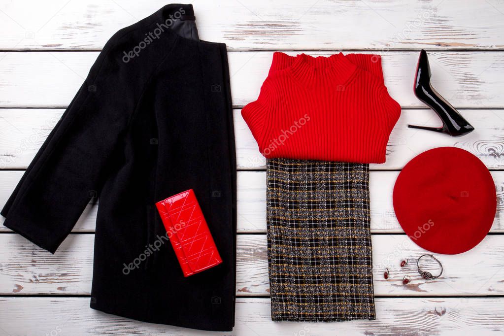 Winter womens outfit with hat, wallet and accessories.