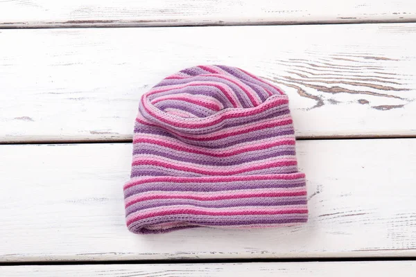 Pink striped woolen hat.