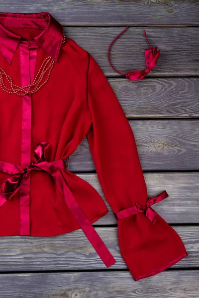 Flat lay shot of polyester satin lycra fabric red jacket. — Stock Photo, Image