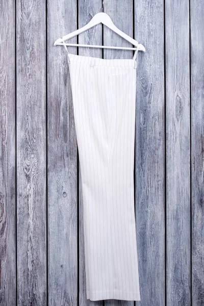 White business trousers on hanger. — Stock Photo, Image