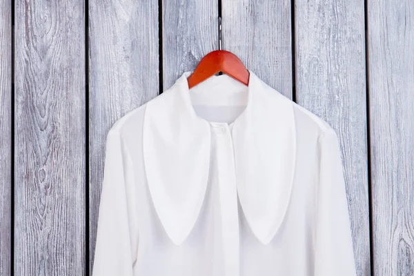 Close up white blouse with big collar.