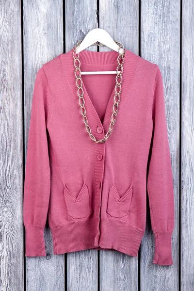 Pink wool coat with accessorie, flat lay.