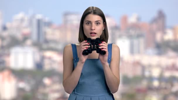 Cheerful lady looking through binoculars. — Stock Video