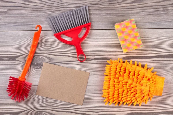 House cleaning items on wooden background. — Stock Photo, Image