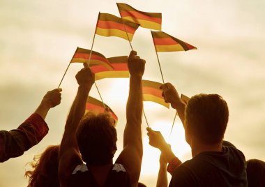 People hold german flags. clipart