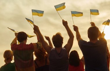 Ukrainian patriots with small flags. clipart