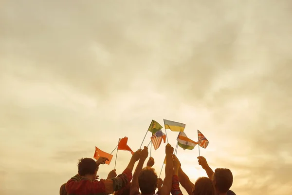 People stick together with various country flags. — Stock Photo, Image