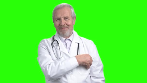 Senior doctor shows business card. — Stock Video