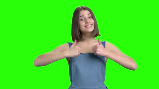 Young woman shows two thumbs up. — Stock Video